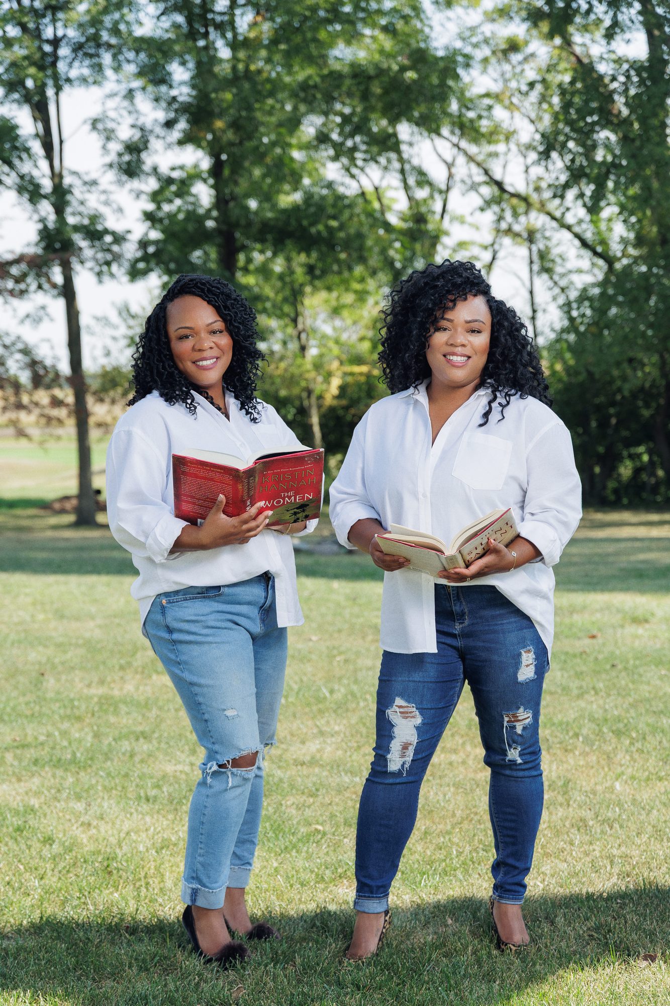Tee and Tam reading their favorite books outdoors in the sunshine
